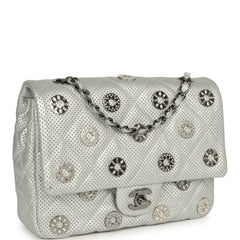 Chanel Small Eyelets Flap Bag in silver metallic perforated calfskin with eyelets and a chain crossbody strap.