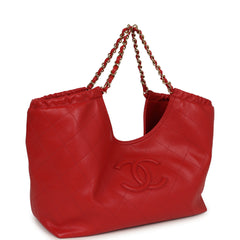 Chanel Small CC Cabas Hobo Bag, shown in dark red quilted shiny calfskin with gold chain straps and a front logo emblem.