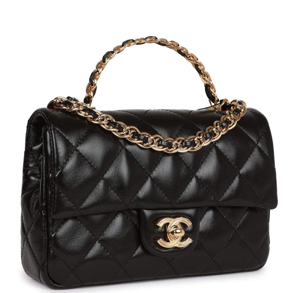 Flap bag with top handle, Lambskin & gold-tone metal, black — Fashion