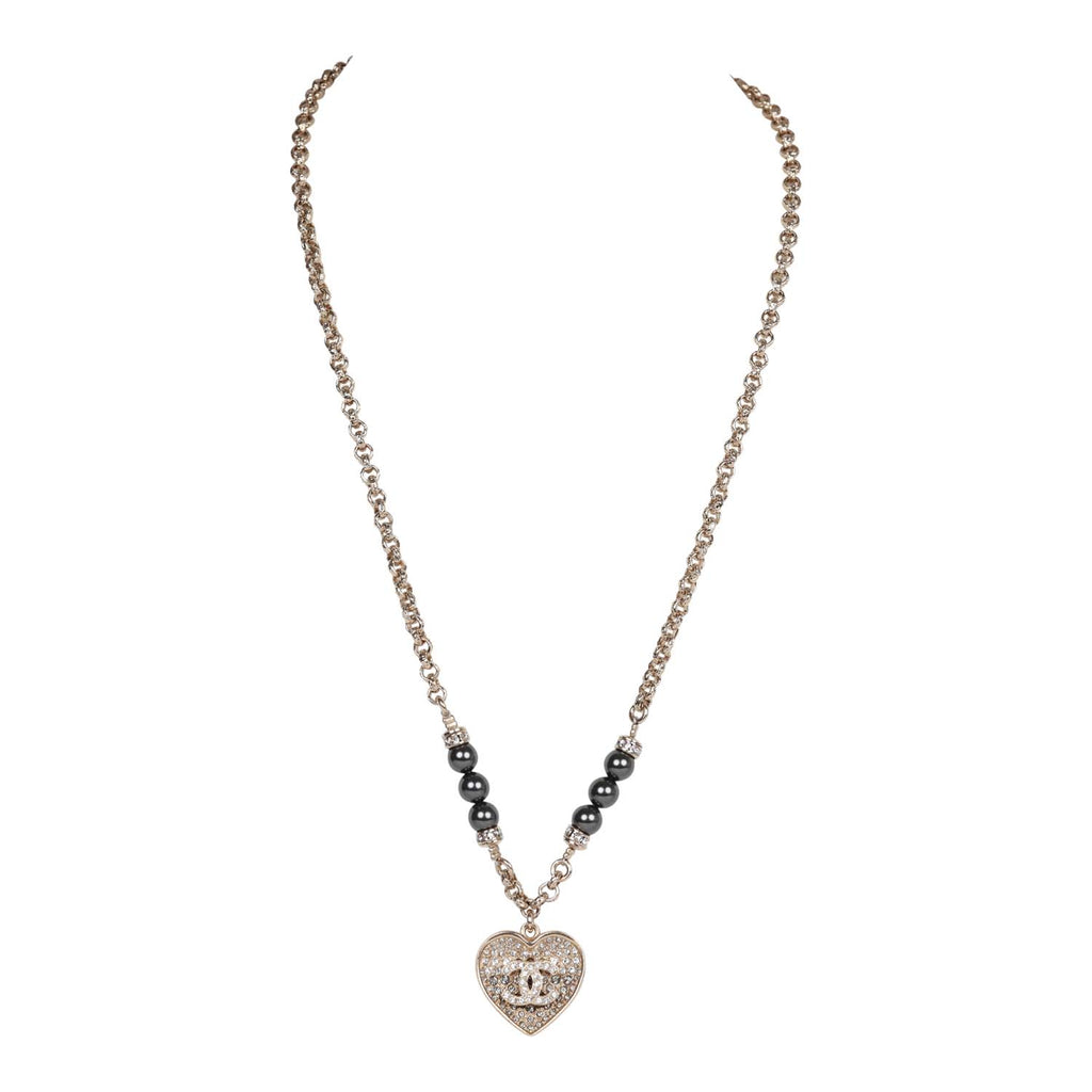 Chanel Black and Silver CC Crystal Heart Pendant Necklace – Madison Avenue  Couture