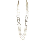Chanel Long Crystal CHA-NEL Multi-Strand CC Pearl Necklace Ivory Pearls, Light Gold Tone Hardware - Thumbnail View 1