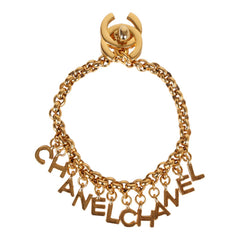Vintage Chanel 24K Gold Plated "Chanel" Logo Charms Turnlock Bracelet