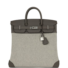 Hermès Birkin HAC 40, showing Etain Togo leather, Ecru-Black Toile H canvas, palladium hardware, and grey leather corners.