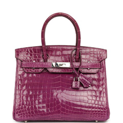 Hermes Birkin 30, a pre-owned violet shiny Niloticus crocodile bag with palladium hardware, top handle, and attached lock.