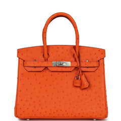 Hermes Birkin 30 Tangerine Ostrich handbag, featuring palladium hardware and a hanging padlock.