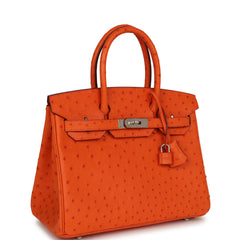 Hermes Birkin 30 Tangerine Ostrich Palladium Hardware handbag shown with a padlock.