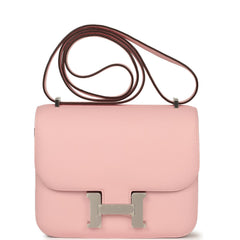 Hermès Constance 18 Rose Sakura Swift bag, featuring a silver H-shaped clasp and thin strap.
