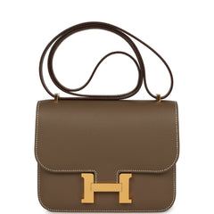 Hermes Constance 18 Etoupe Epsom bag, featuring gold hardware, white contrast stitching, H-clasp, and an adjustable strap.