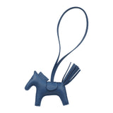 Hermès Rodeo Bag Charm PM in Bleu Tie: a Milo lambskin horse-shaped charm with a matching strap and tail tassel.