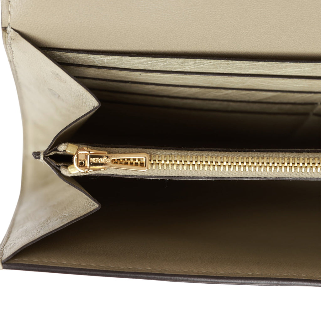 A GOLD OSTRICH CONSTANCE LONG WALLET WITH PALLADIUM HARDWARE