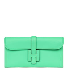 Hermès Jige Elan 29 Vert Comics Swift clutch, a bright green leather bag with a central H-shaped tab closure.