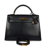 Vintage Hermès Kelly Sellier 32 Bleu Indigo Box Gold Hardware handbag, featuring a top handle, padlock, and shoulder strap.