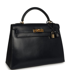 Vintage Hermès Kelly Sellier 32, a Bleu Indigo Box leather bag with gold hardware, lock, and key clochette.
