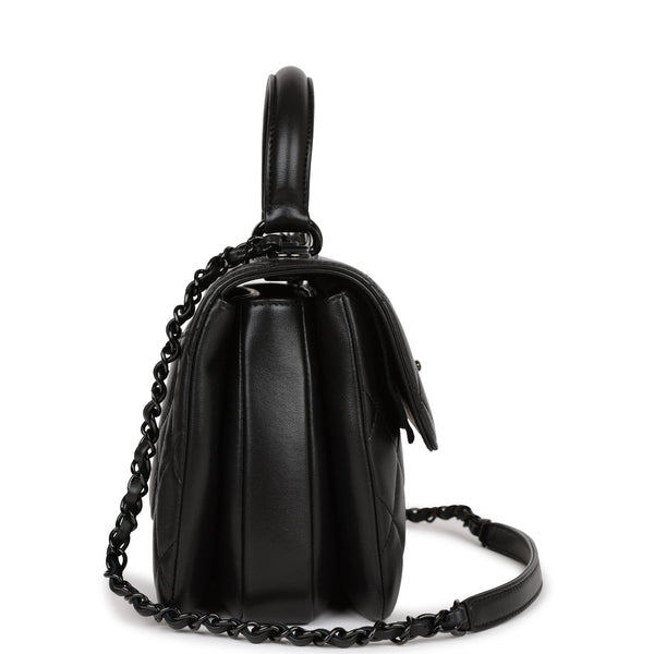 Flap bag with top handle, Lambskin & gold-tone metal, black — Fashion