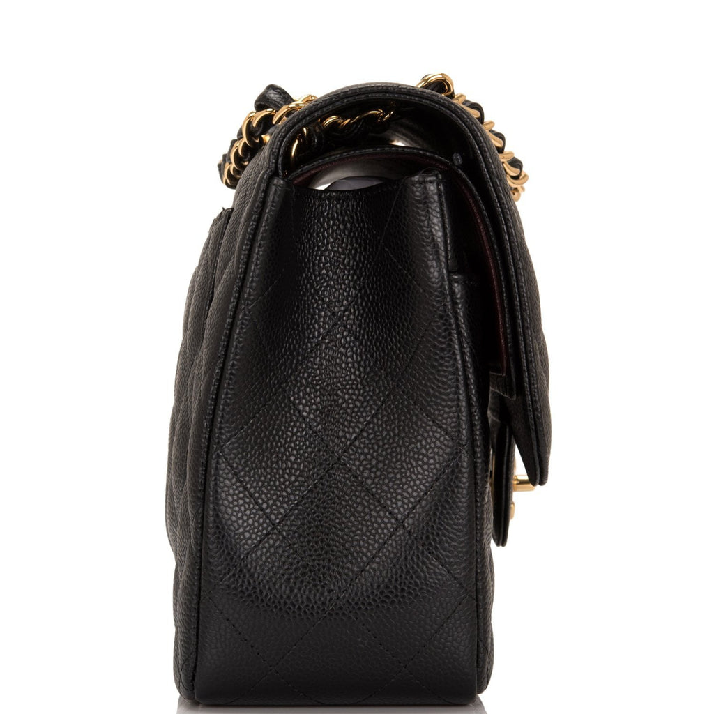 LOT:2092C  Black Chanel caviar leather classic jumbo flap bag with