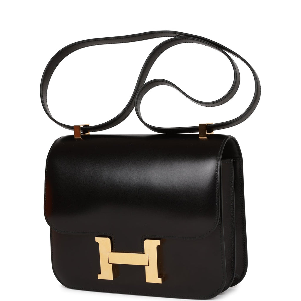 Sold at Auction: An Hermès black box leather Constance bag with gold plated  brass hardware