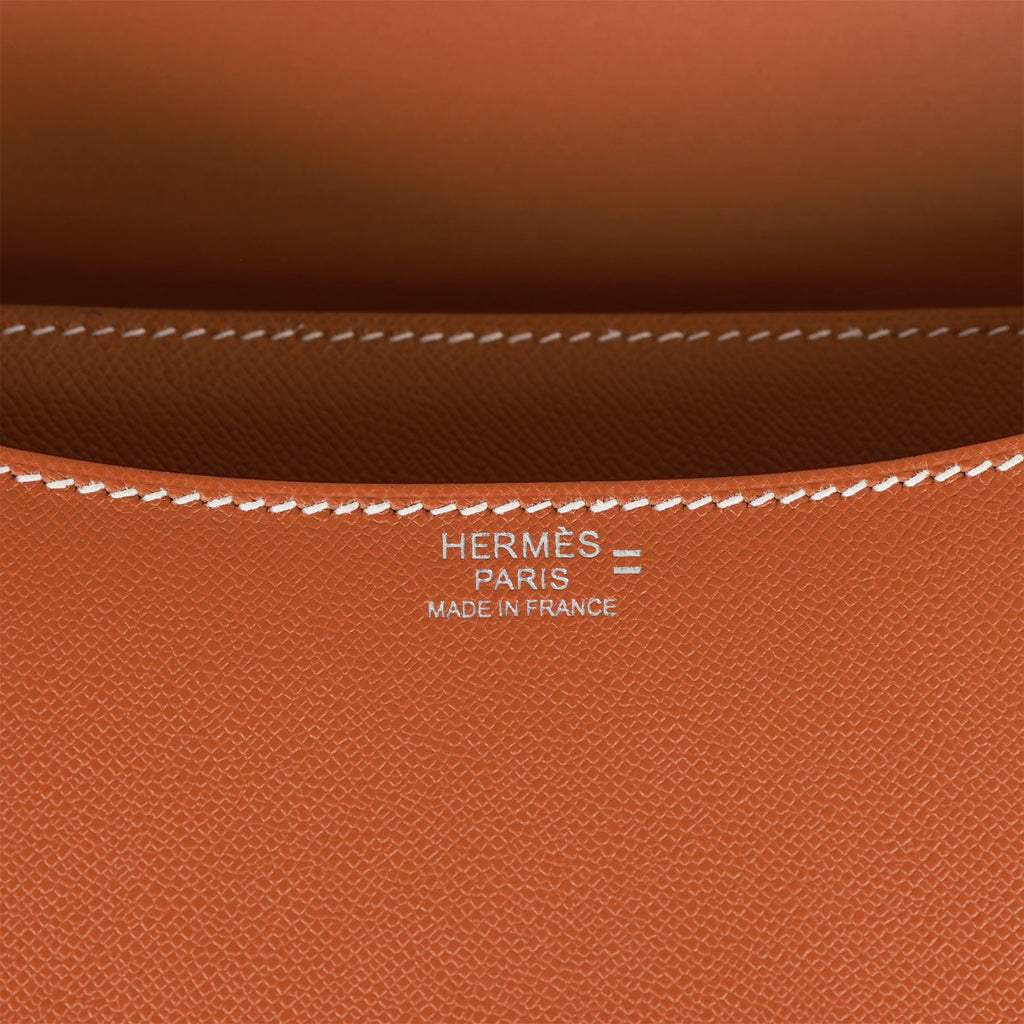Constance leather clutch bag Hermès Orange in Leather - 35871229