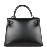 A LIMITED EDITION BLACK CALF BOX LEATHER SELLIER KELLY 28 WITH GUILLOCHÉ  PALLADIUM HARDWARE