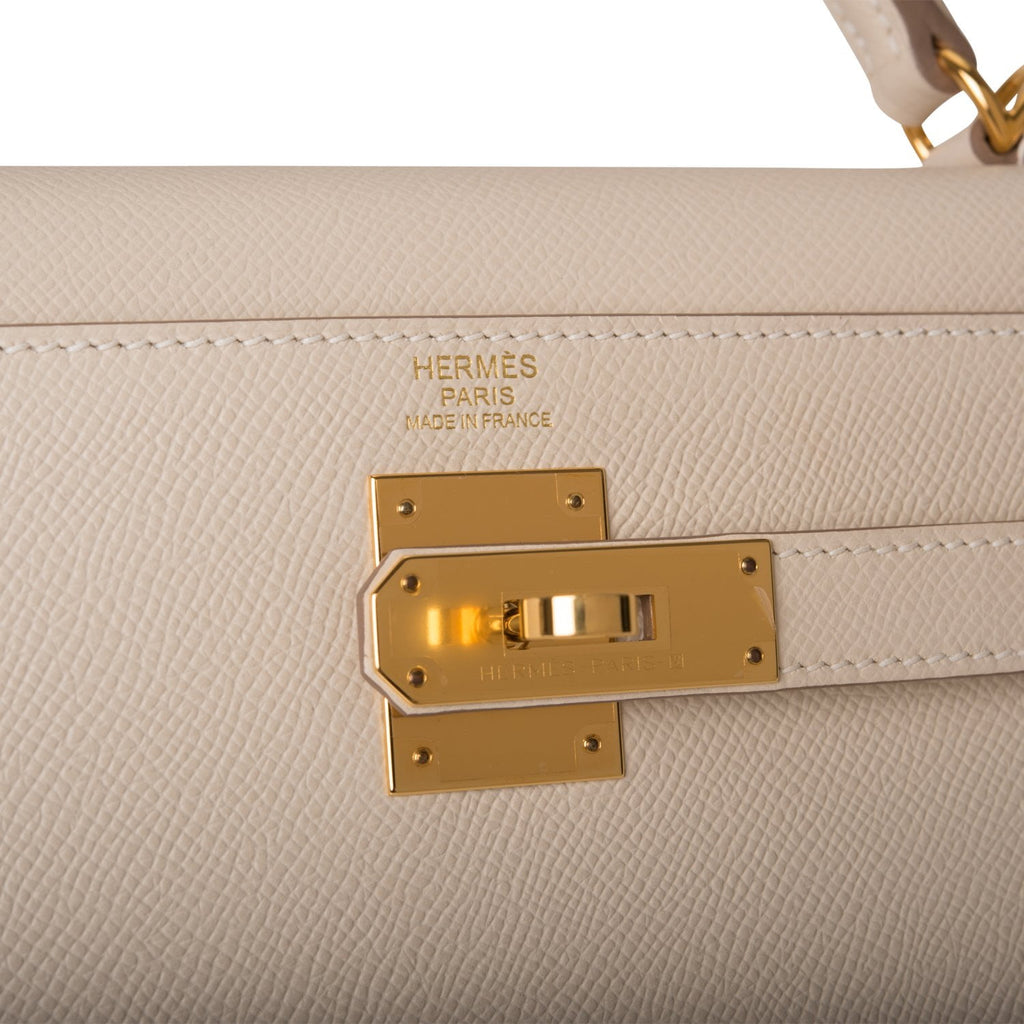 A WHITE EPSOM LEATHER SELLIER KELLY 32 WITH GOLD HARDWARE, HERMÈS